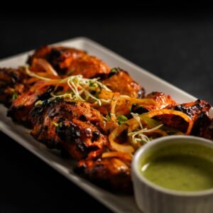Juicy grilled chicken tandoori served with fresh mint chutney and herbs.